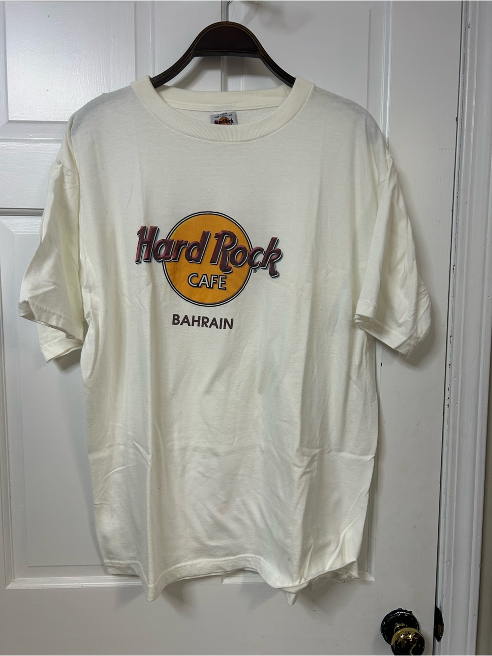 Vintage Hard Rock Cafe Cream T-Shirt with Yellow Logo and Brown Text